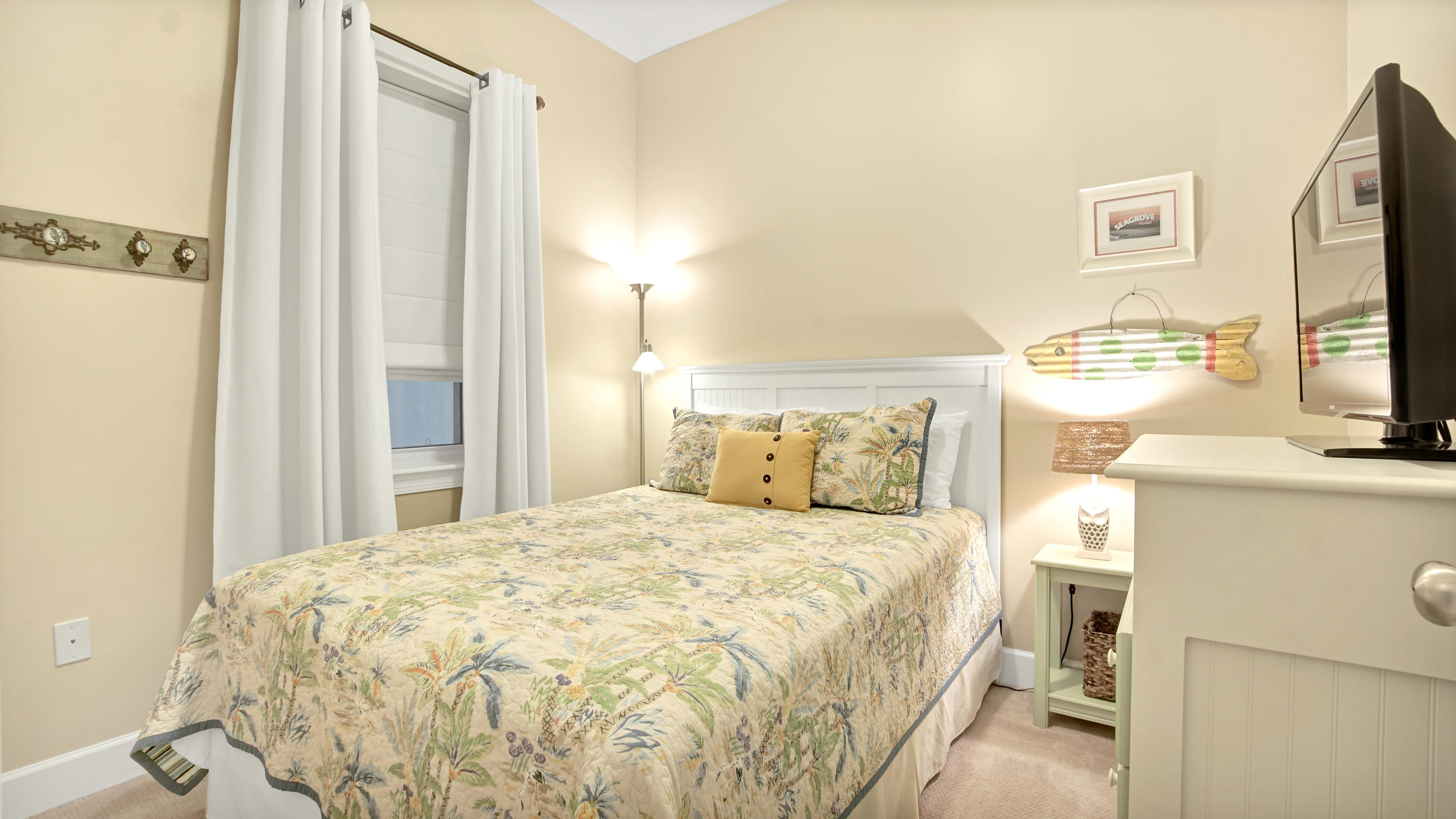 231 Somerset Bridge Road, Unit 1404 Santa Rosa Beach, FL 32459 - Photo 6 of 40 a bedroom with a bed flat screen tv and a dresser
