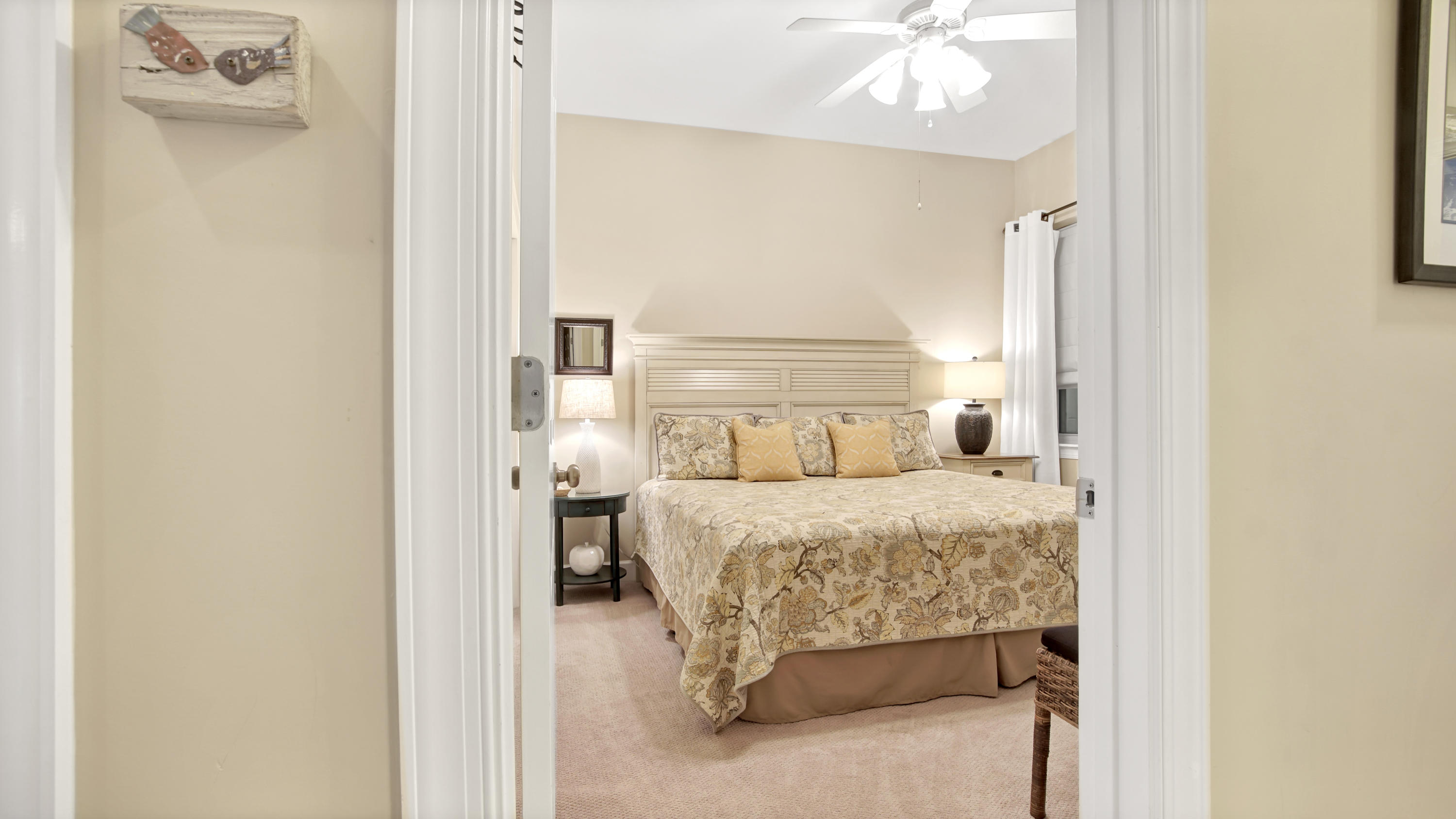 231 Somerset Bridge Road, Unit 1404 Santa Rosa Beach, FL 32459 - Photo 10 of 40 a bedroom with a bed and a chandelier
