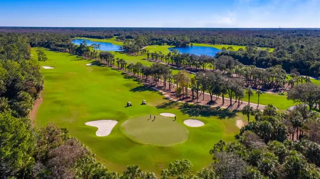 a view of a swimming pool with an outdoor space and seating area