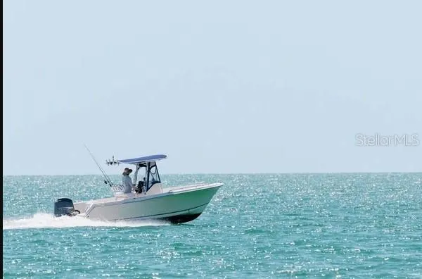 a room with a sink and a mirror
