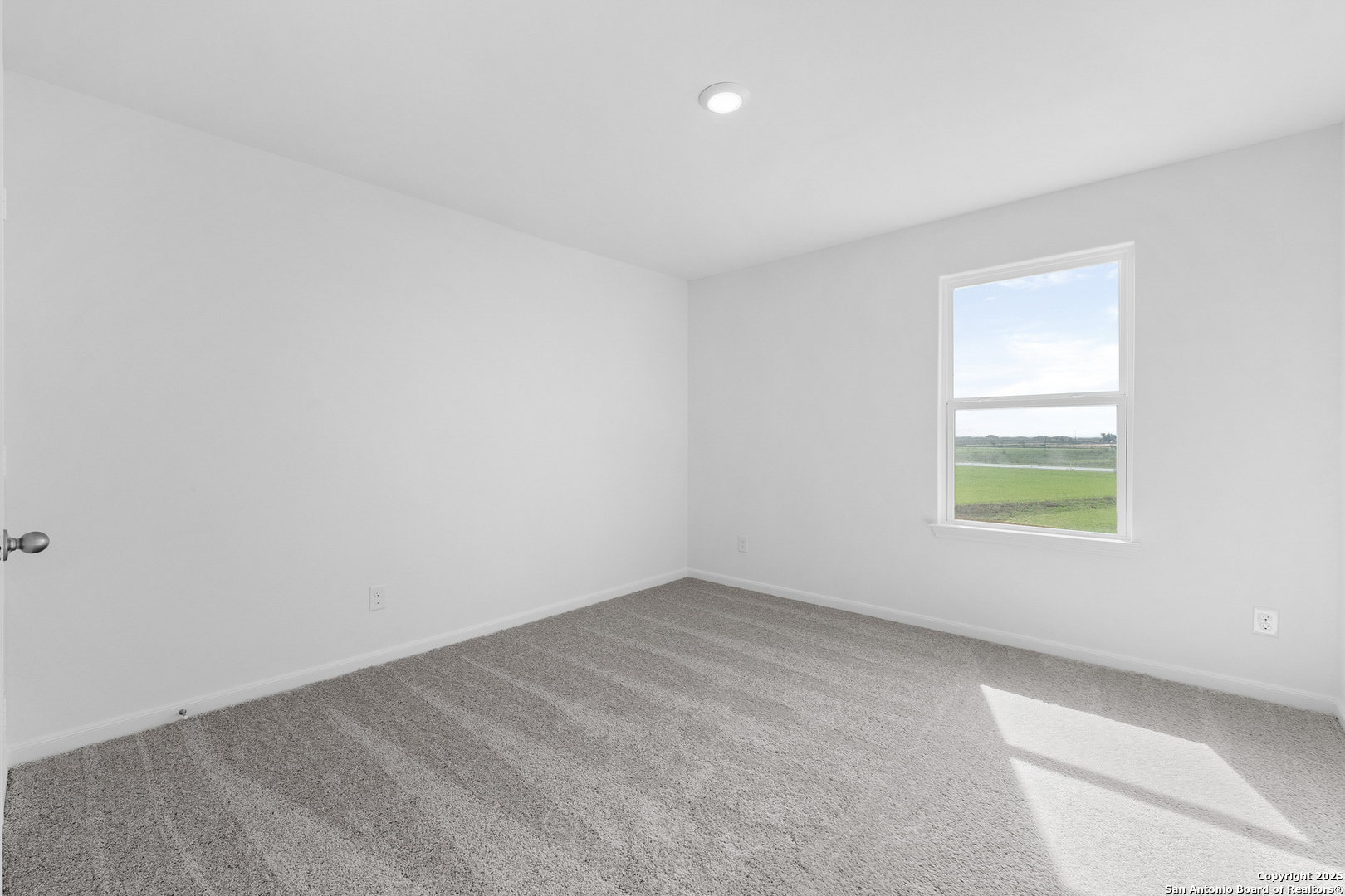 16020 Stratford Cove Lytle, TX 78052 - Photo 14 of 29 an empty room with a window