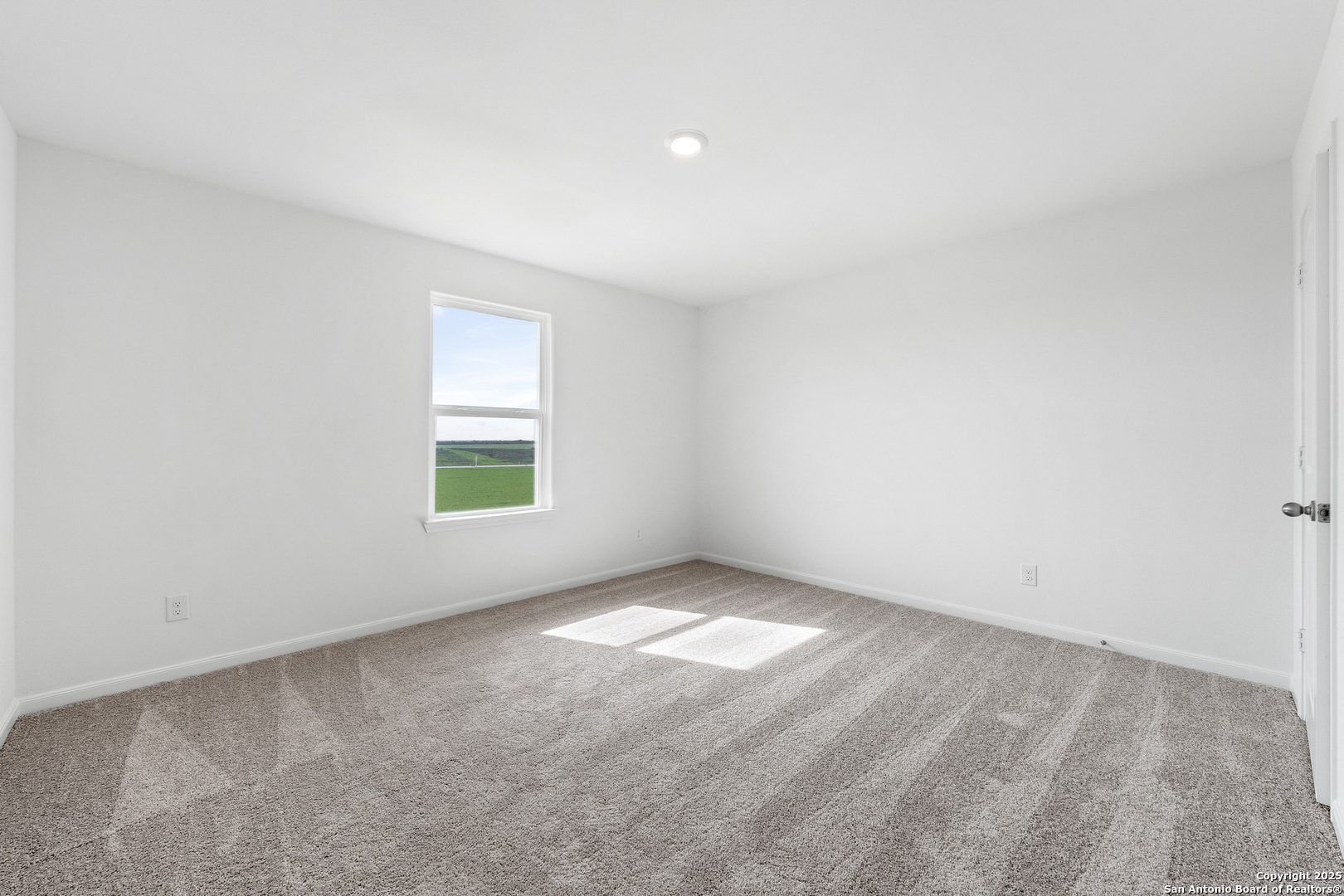 16020 Stratford Cove Lytle, TX 78052 - Photo 15 of 29 an empty room with windows