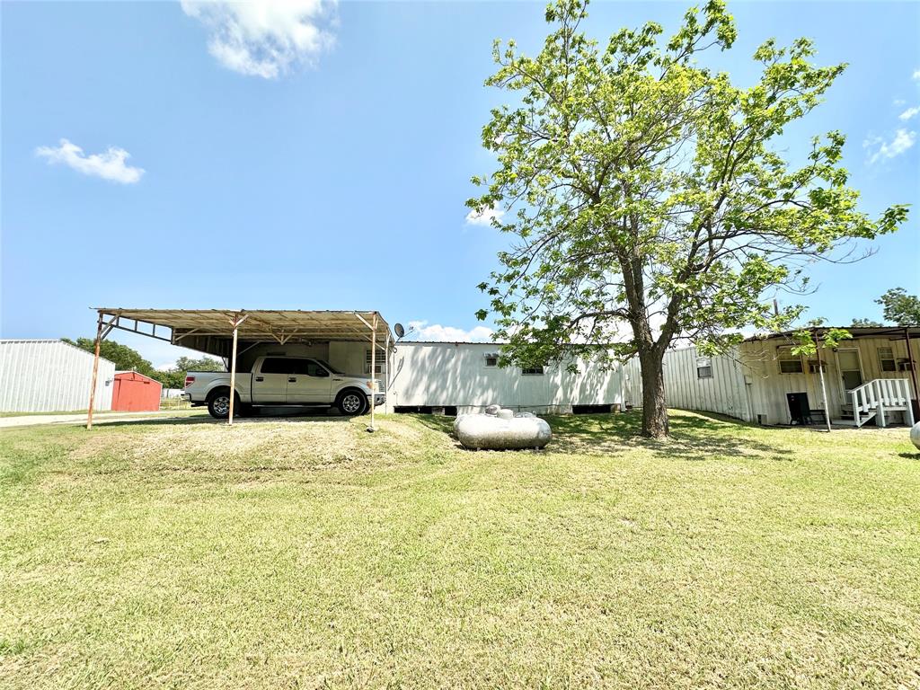 3210 Rural Ranch Road, Unit 14 Gainesville, TX 76240 - Photo 11 of 19 a swimming pool with some trees in the background