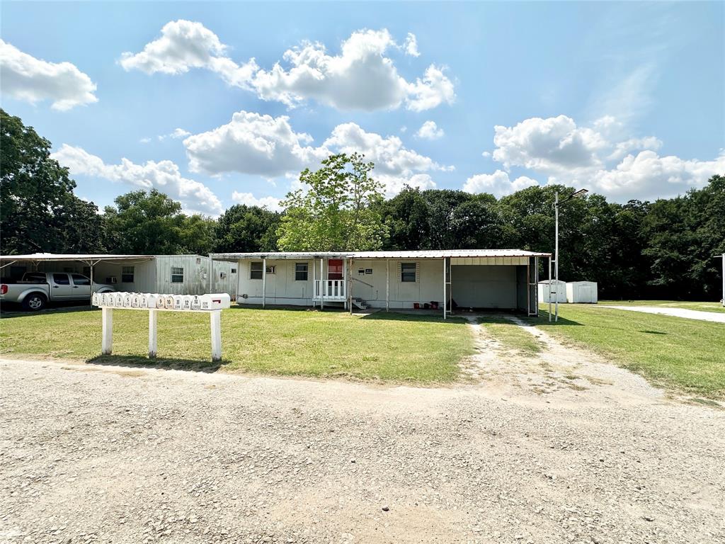 3210 Rural Ranch Road, Unit 14 Gainesville, TX 76240 - Photo 2 of 19 a view of a swimming pool with a yard