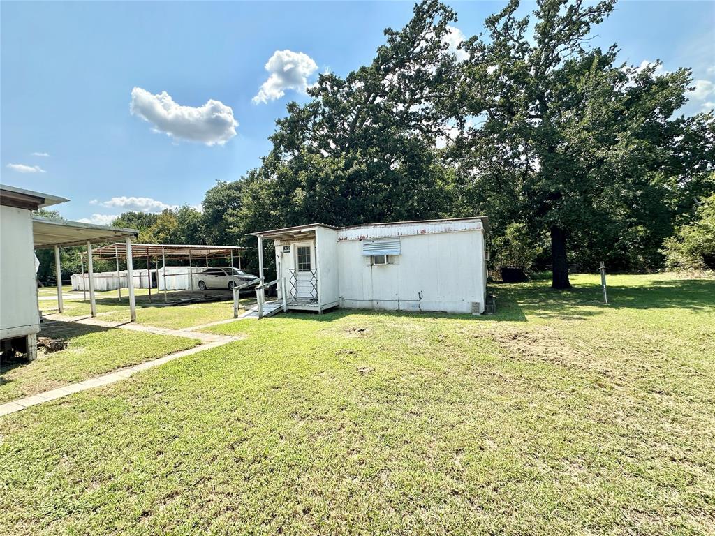 3210 Rural Ranch Road, Unit 14 Gainesville, TX 76240 - Photo 5 of 19 a house view with a outdoor space