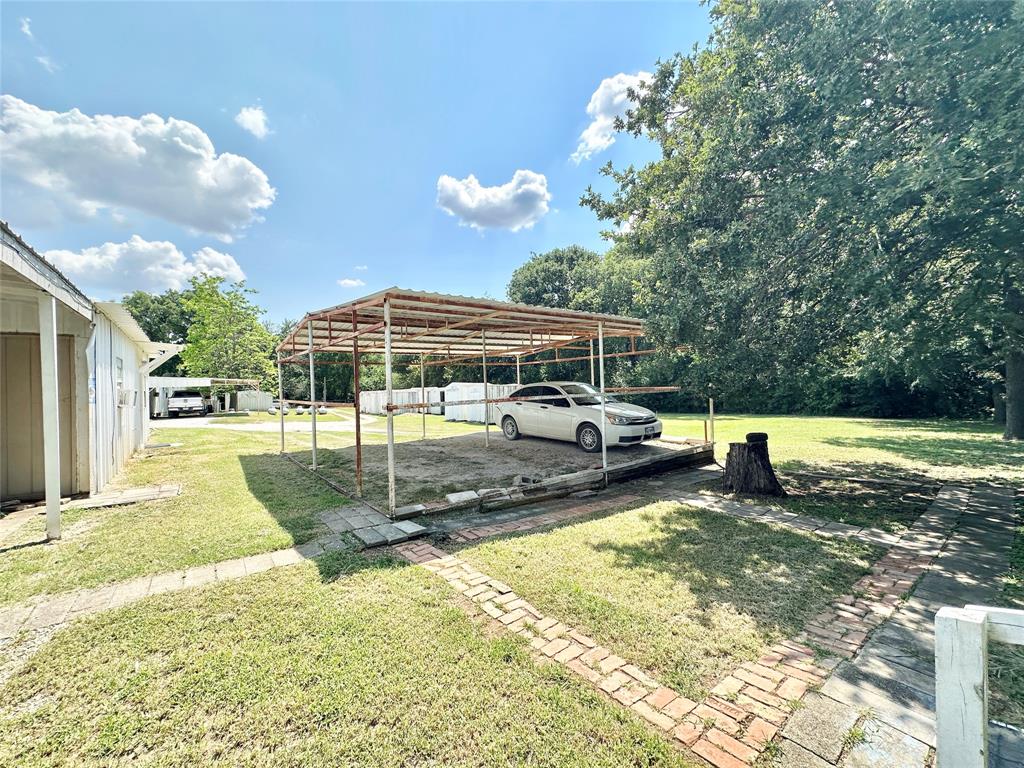3210 Rural Ranch Road, Unit 14 Gainesville, TX 76240 - Photo 6 of 19 a view of a swimming pool with a patio and a yard