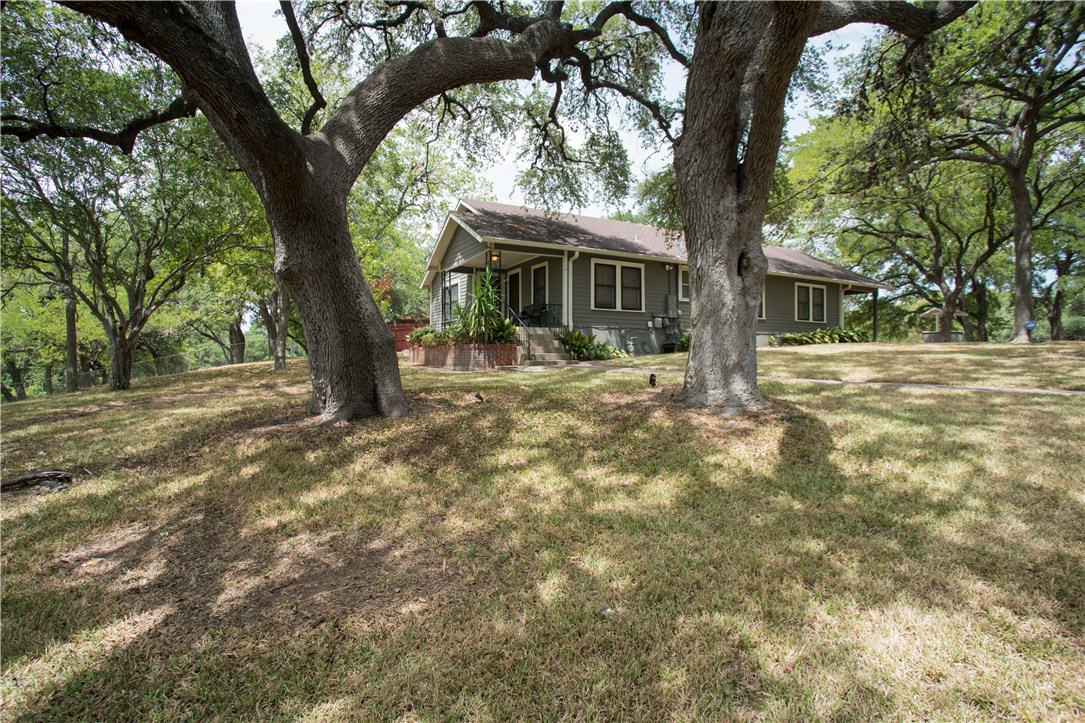 3003 Burleson Road Austin, TX 78741 - Photo 5 of 35 Welcome to your Ponderosa in East Austin -- massive oaks and shade in the front yard