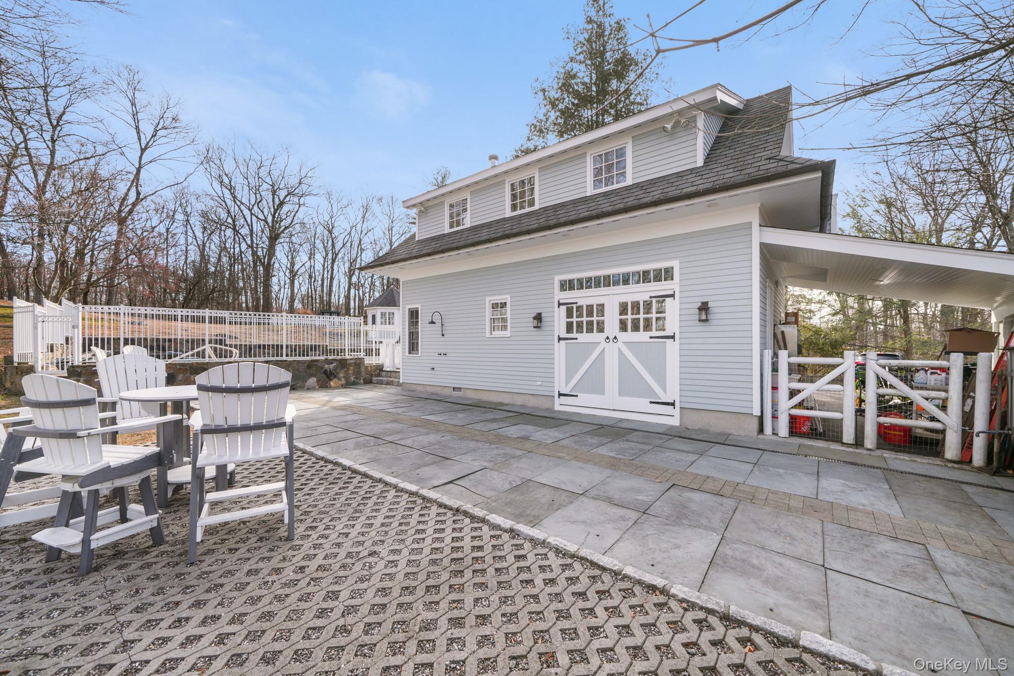 320 Illington Road Ossining, NY 10562 - Photo 24 of 42 a view of a patio with a table and chairs and a barbeque