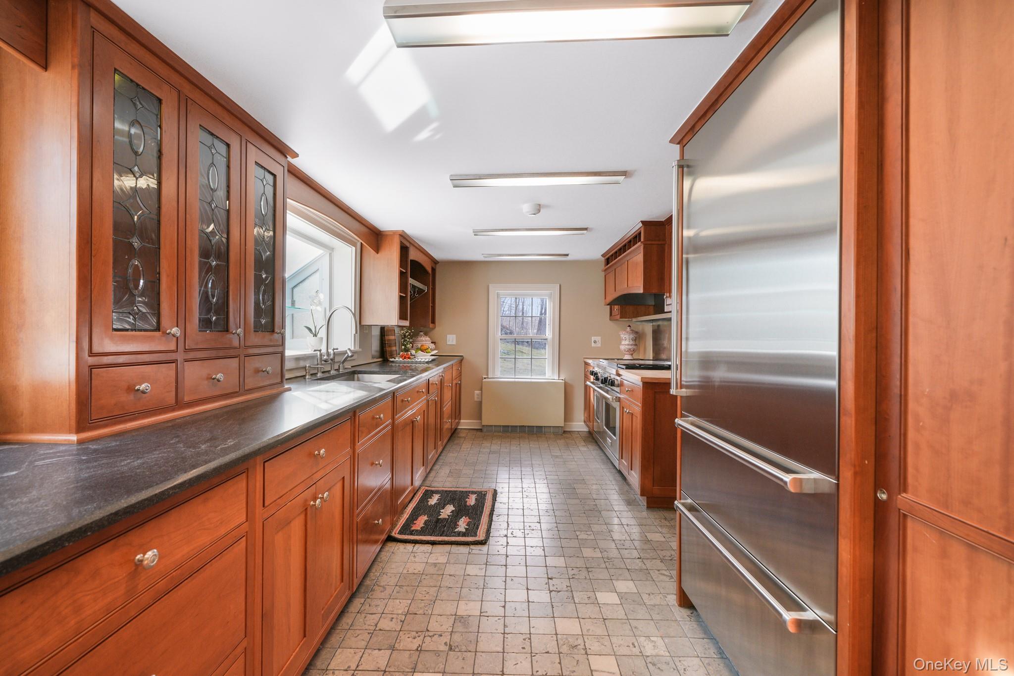 320 Illington Road Ossining, NY 10562 - Photo 3 of 42 a kitchen with granite countertop stainless steel appliances a counter top space and cabinets