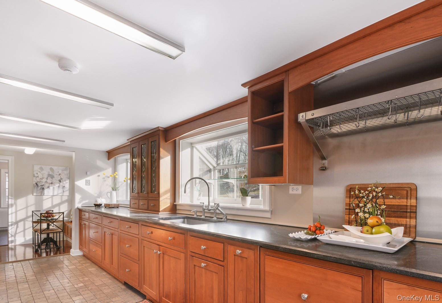 320 Illington Road Ossining, NY 10562 - Photo 4 of 42 a kitchen with stainless steel appliances a sink stove and cabinets