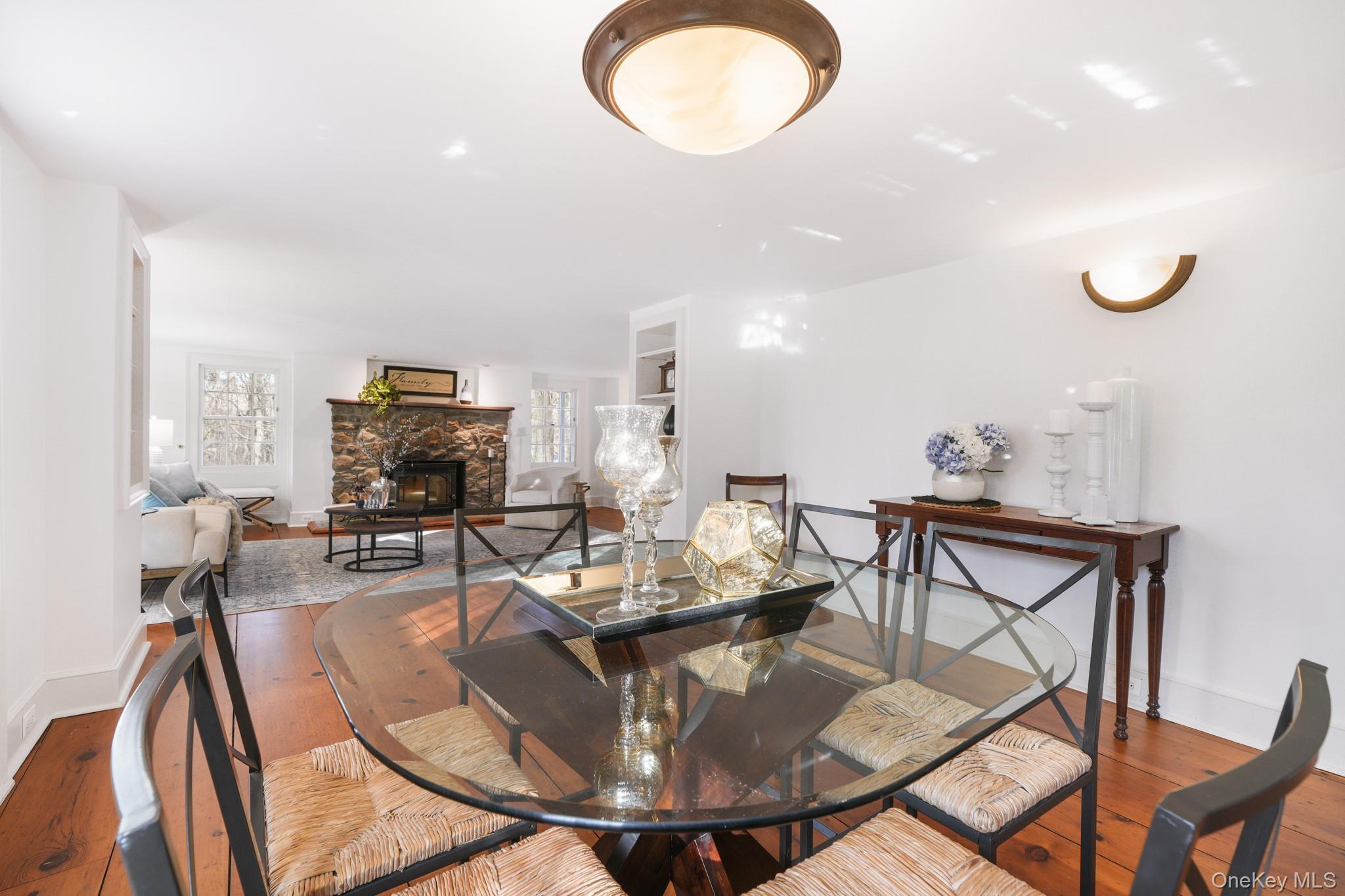 320 Illington Road Ossining, NY 10562 - Photo 7 of 42 a living room with furniture a flat screen tv and kitchen view