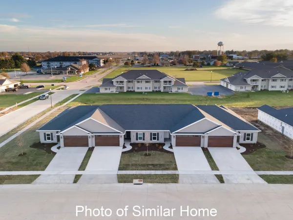 an aerial view of a house with a ocean view