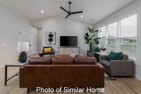 a living room with furniture and a flat screen tv