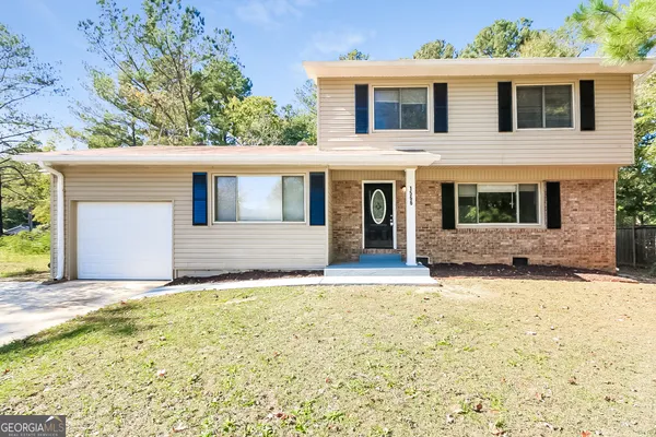 a house that has a large window in front of it