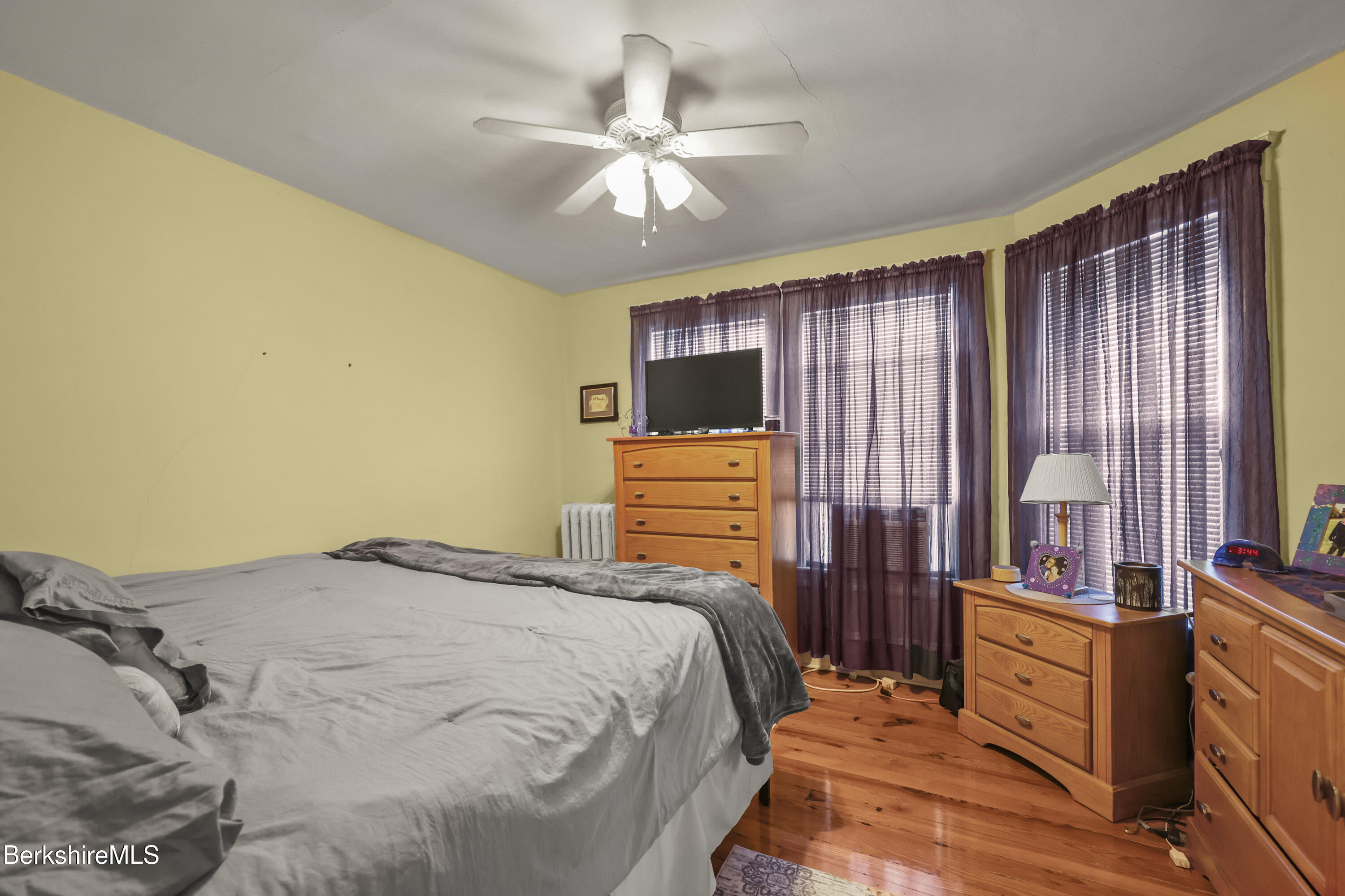 3-5 Melrose Street Adams, MA 01220 - Photo 21 of 37 a bedroom with a bed and a chandelier