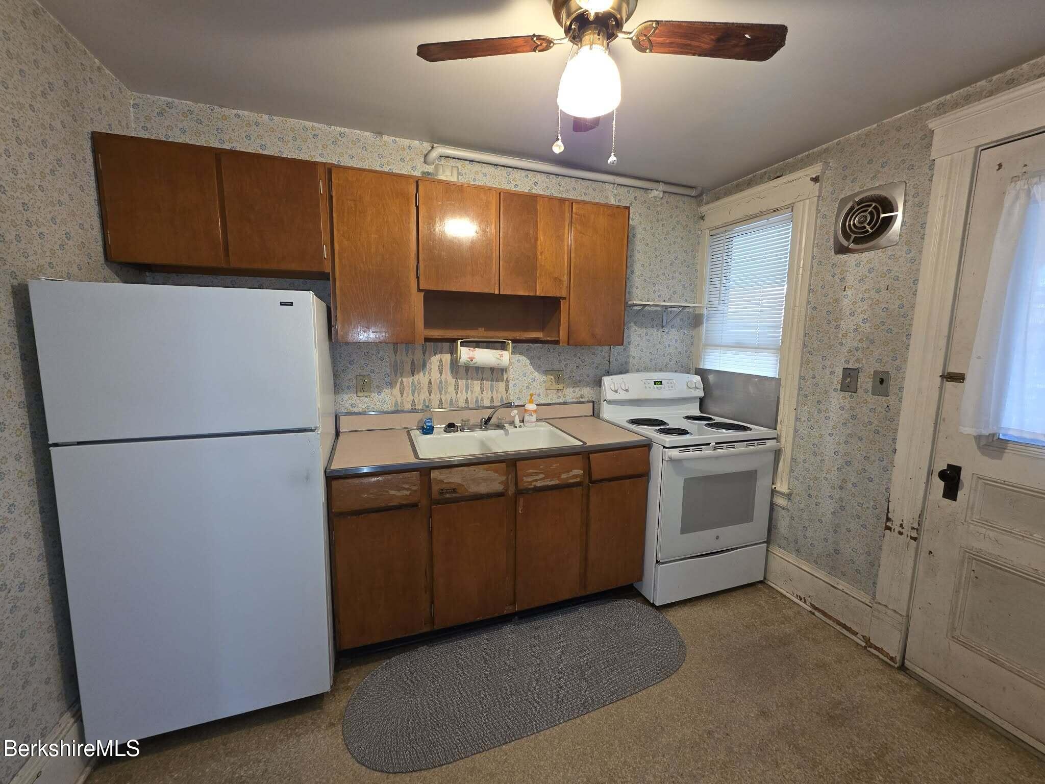 3-5 Melrose Street Adams, MA 01220 - Photo 22 of 37 a kitchen with refrigerator a stove a sink and dishwasher