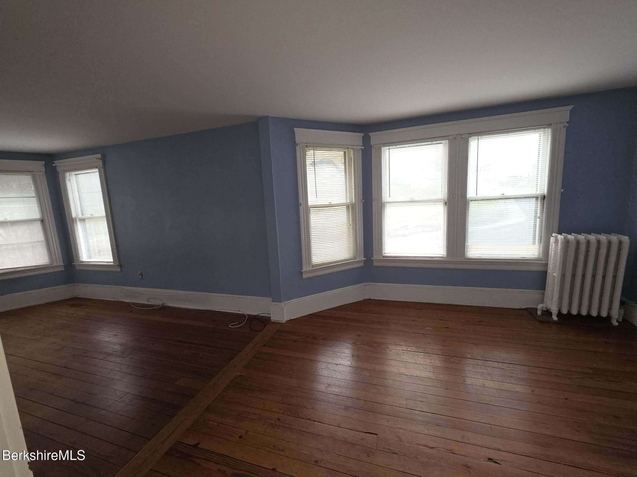 3-5 Melrose Street Adams, MA 01220 - Photo 25 of 37 wooden floor in an empty room with a window