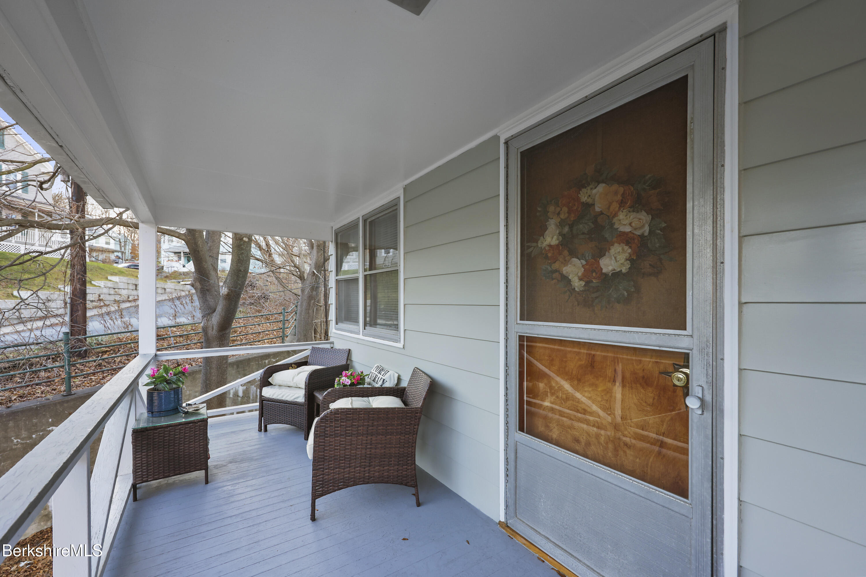3-5 Melrose Street Adams, MA 01220 - Photo 30 of 37 a living room with furniture and a floor to ceiling window