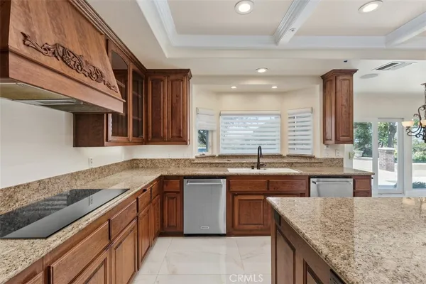 a kitchen with a sink and a wooden cabinets