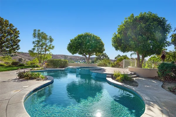 a view of swimming pool with seating space
