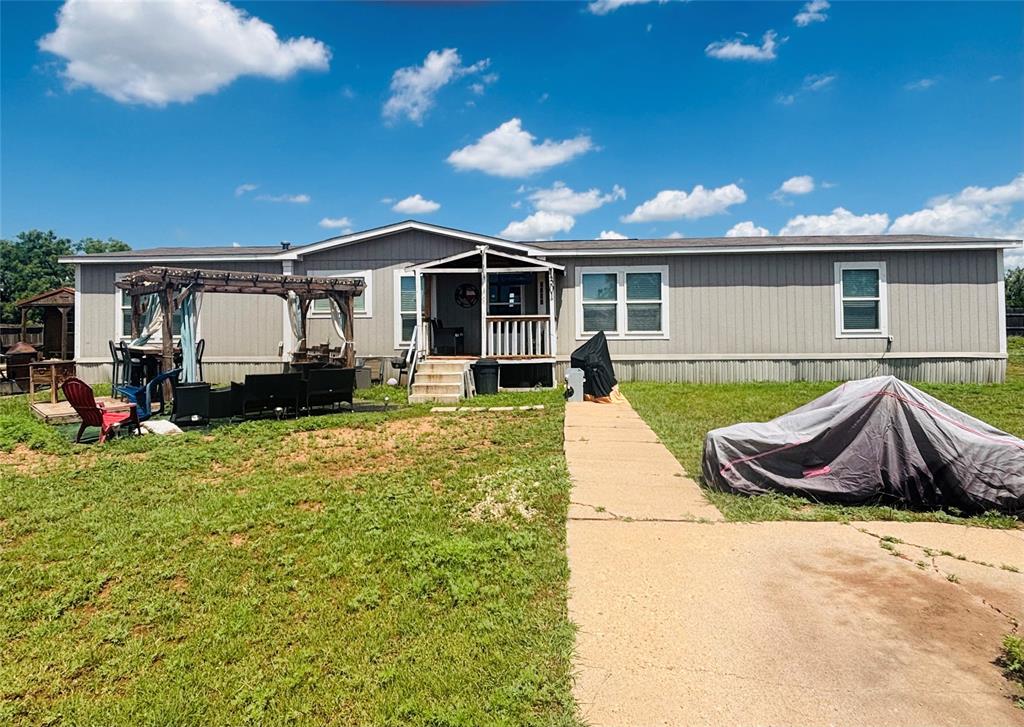 1301 Roma Lane Abilene, TX 79603 - Photo 2 of 20 Manufactured / mobile home featuring a pergola and a front lawn