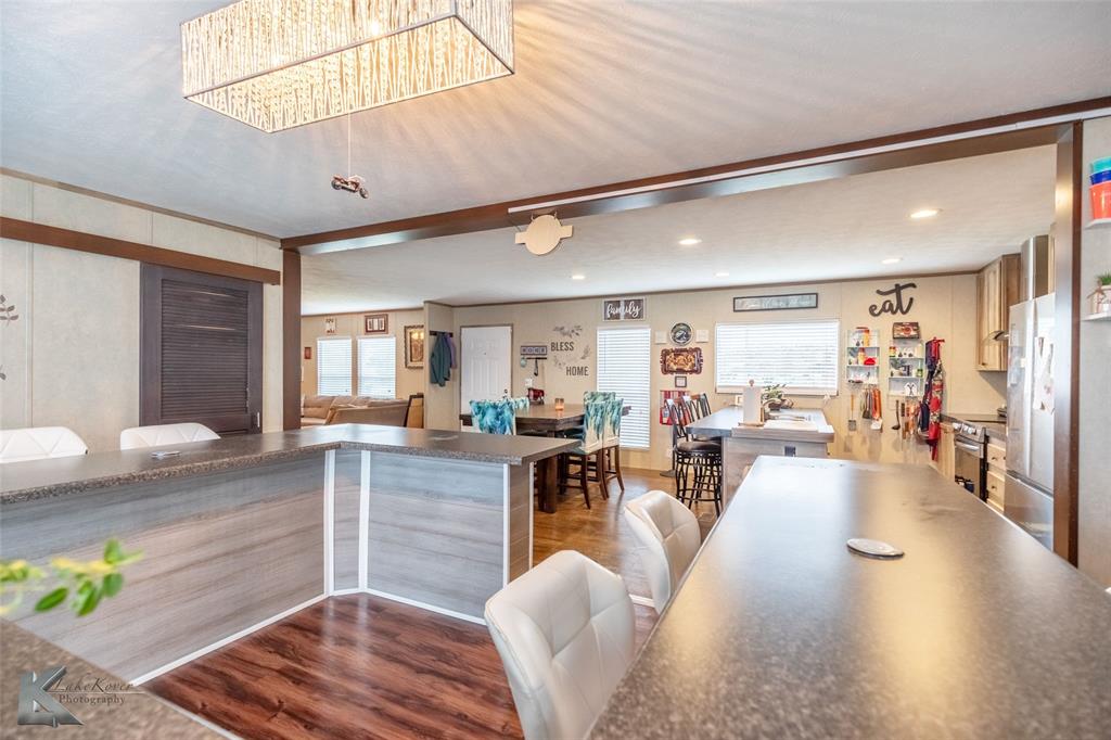 1301 Roma Lane Abilene, TX 79603 - Photo 9 of 20 Kitchen with dark wood-style floors, dark countertops, and recessed lighting