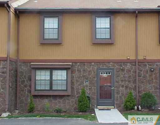 8005 Hana Road Edison, NJ 08817 - Photo 1 of 1 a front view of a house with a yard