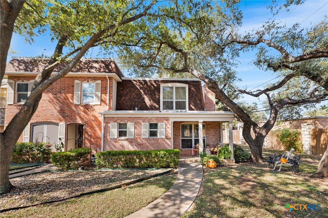 619 Strings Drive, Unit 619 San Antonio, TX 78216 - Photo 2 of 48 a front view of a house with a tree