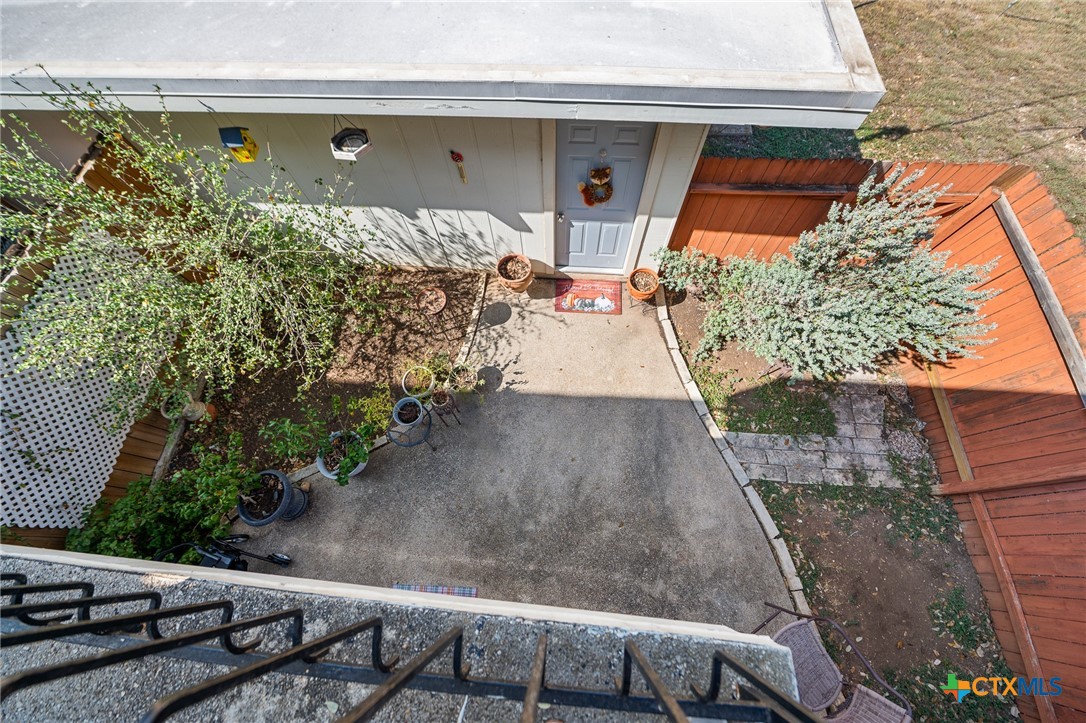 619 Strings Drive, Unit 619 San Antonio, TX 78216 - Photo 34 of 48 a front view of a house with trees