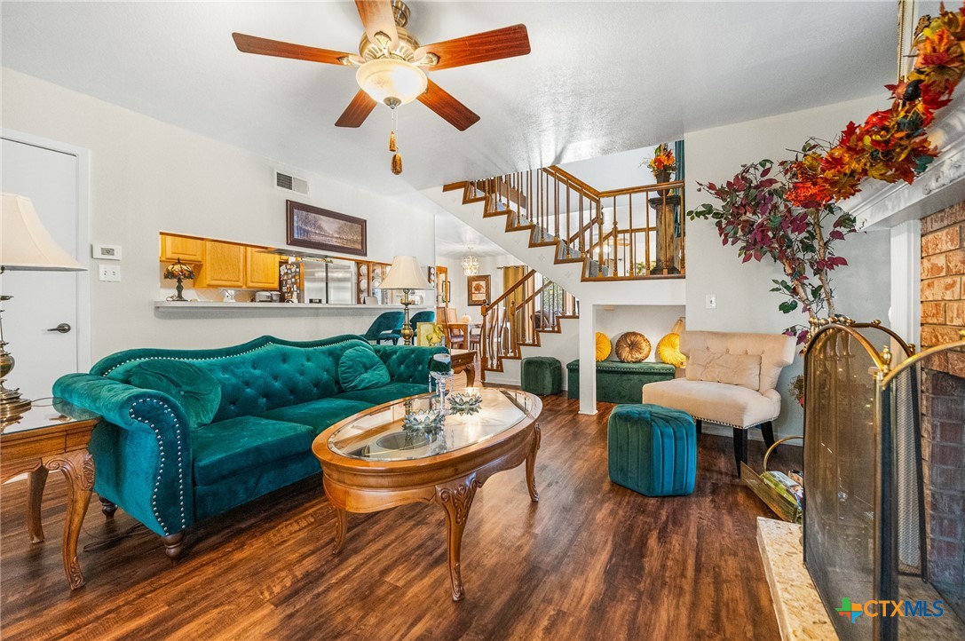 619 Strings Drive, Unit 619 San Antonio, TX 78216 - Photo 8 of 48 a living room with furniture a rug and a chandelier
