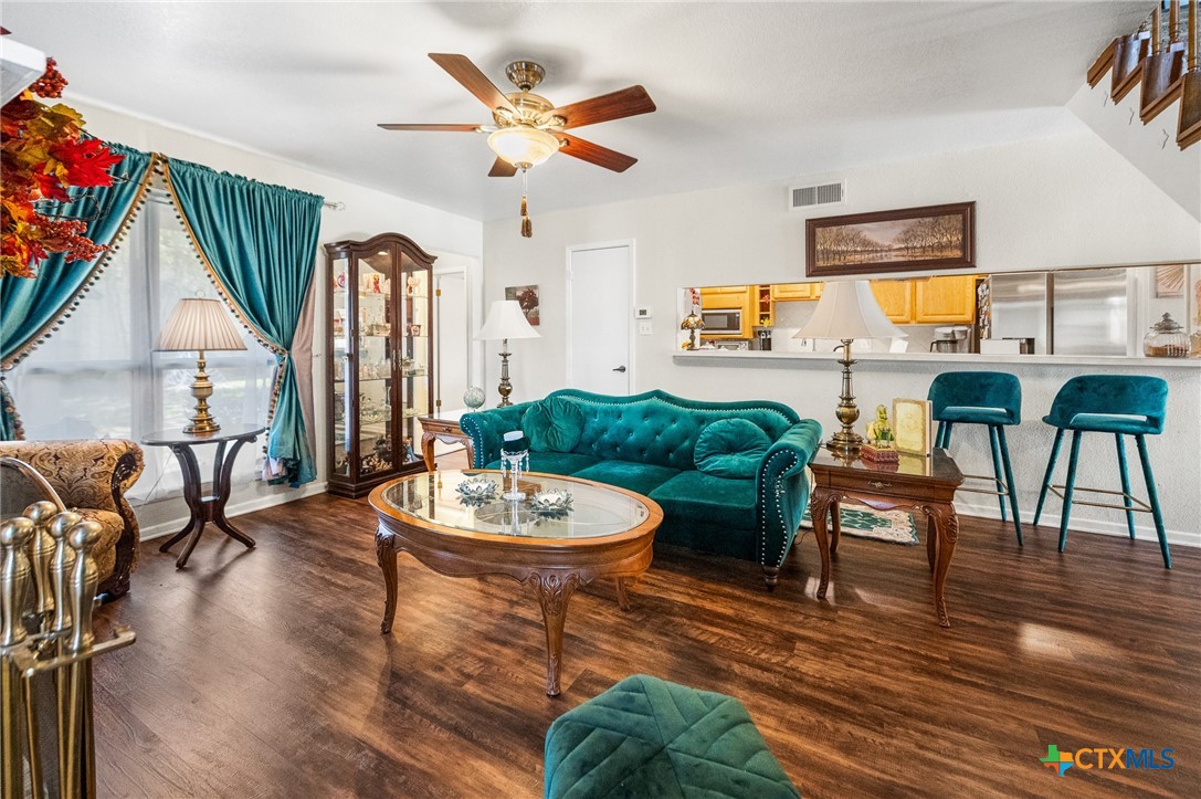 619 Strings Drive, Unit 619 San Antonio, TX 78216 - Photo 9 of 48 a living room with furniture and a large window