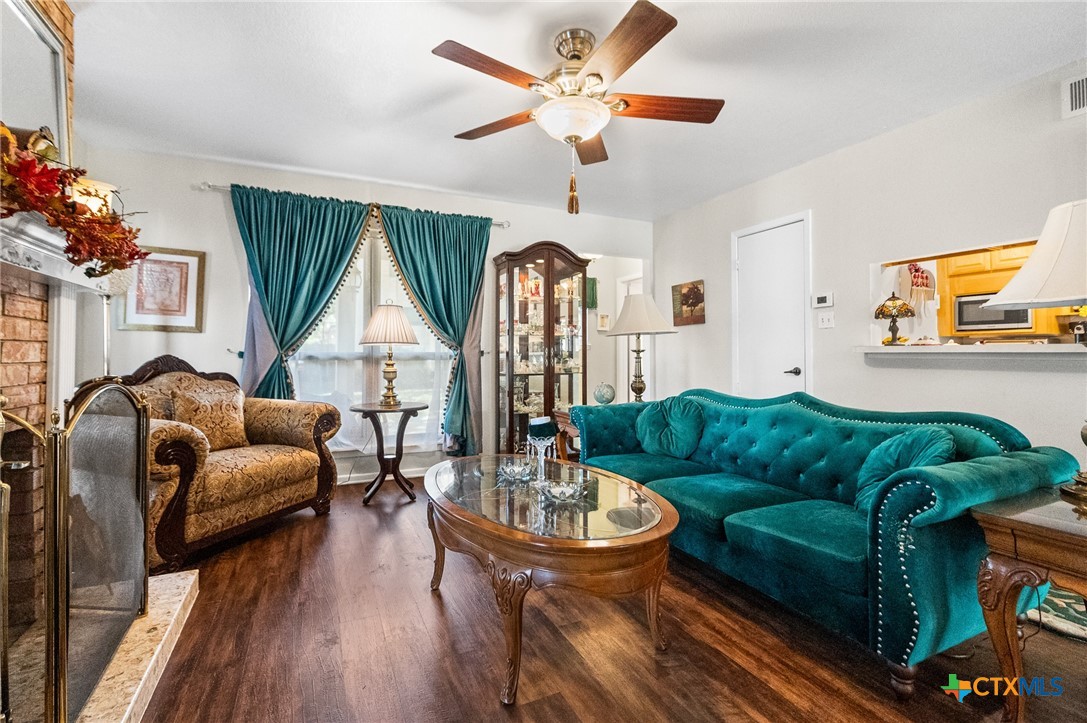 619 Strings Drive, Unit 619 San Antonio, TX 78216 - Photo 10 of 48 a living room with furniture and a large window