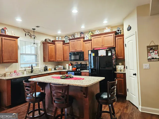 a large kitchen with a table and chairs