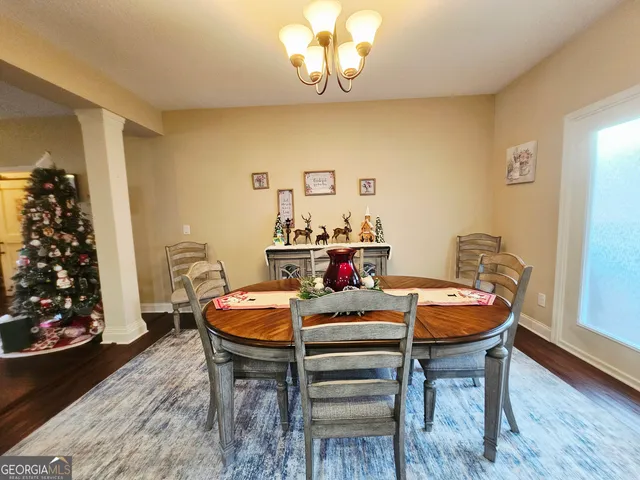a bedroom with furniture and a flat screen tv