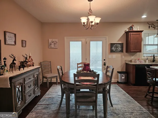a bathroom with a sink a tub and a mirror