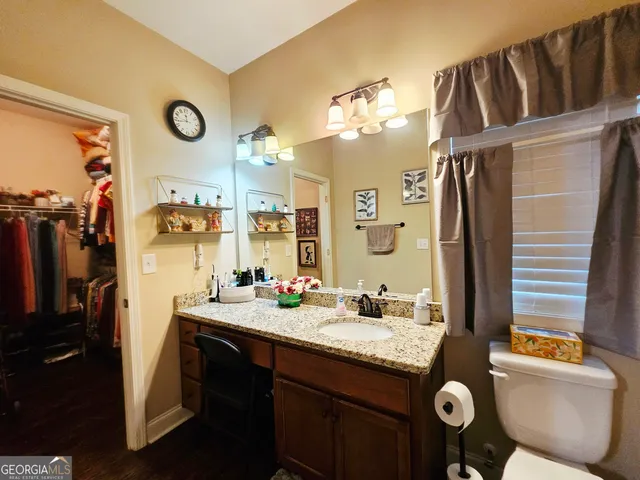 a view of hallway with wooden floor