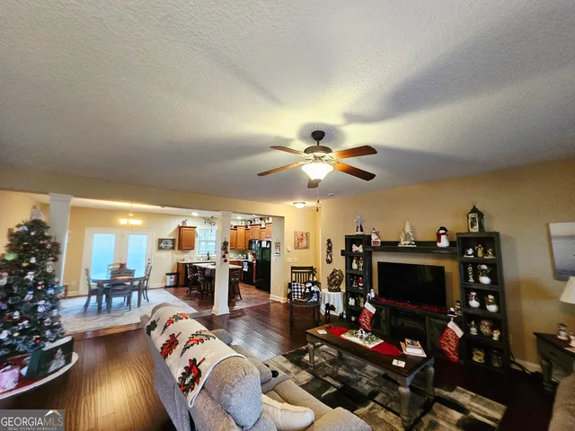 a living room with furniture and a flat screen tv