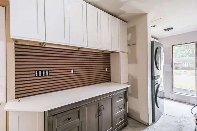 a kitchen with a cabinets and appliances
