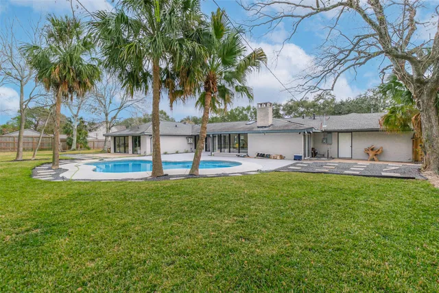 a front view of house with yard and outdoor seating