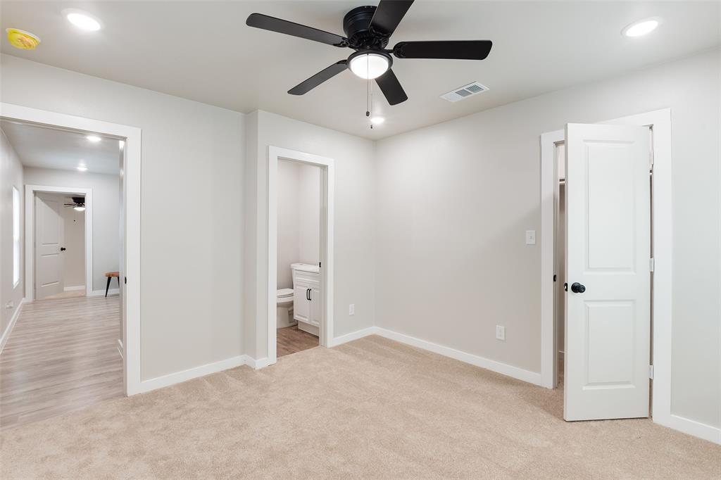 3110 Utah Avenue Dallas, TX 75216 - Photo 13 of 26 en empty room with ceiling fan and wooden floor