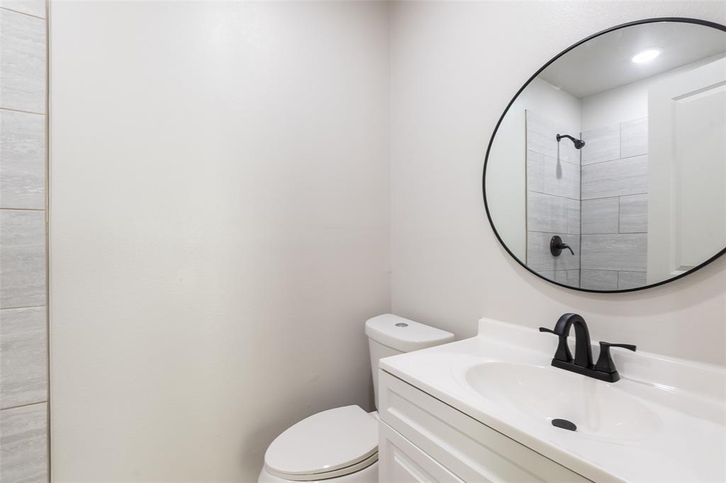 3110 Utah Avenue Dallas, TX 75216 - Photo 15 of 26 a bathroom with a sink and a mirror