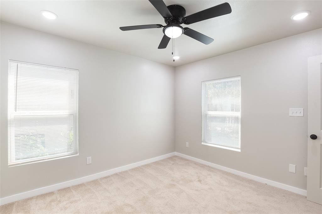 3110 Utah Avenue Dallas, TX 75216 - Photo 16 of 26 an empty room with a window and a fan