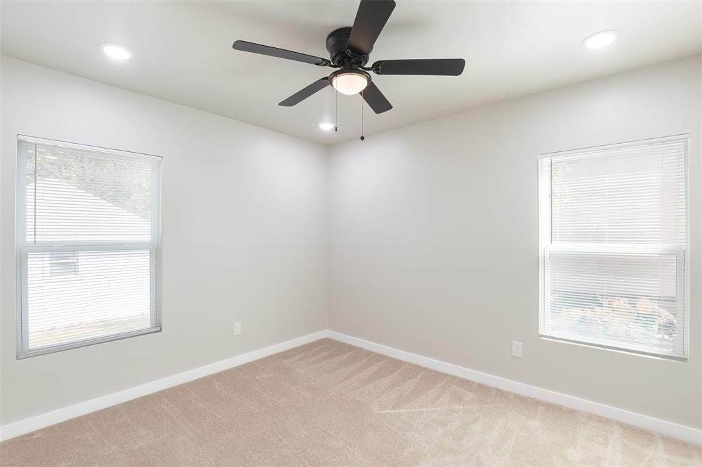 3110 Utah Avenue Dallas, TX 75216 - Photo 17 of 26 an empty room with a window and a fan