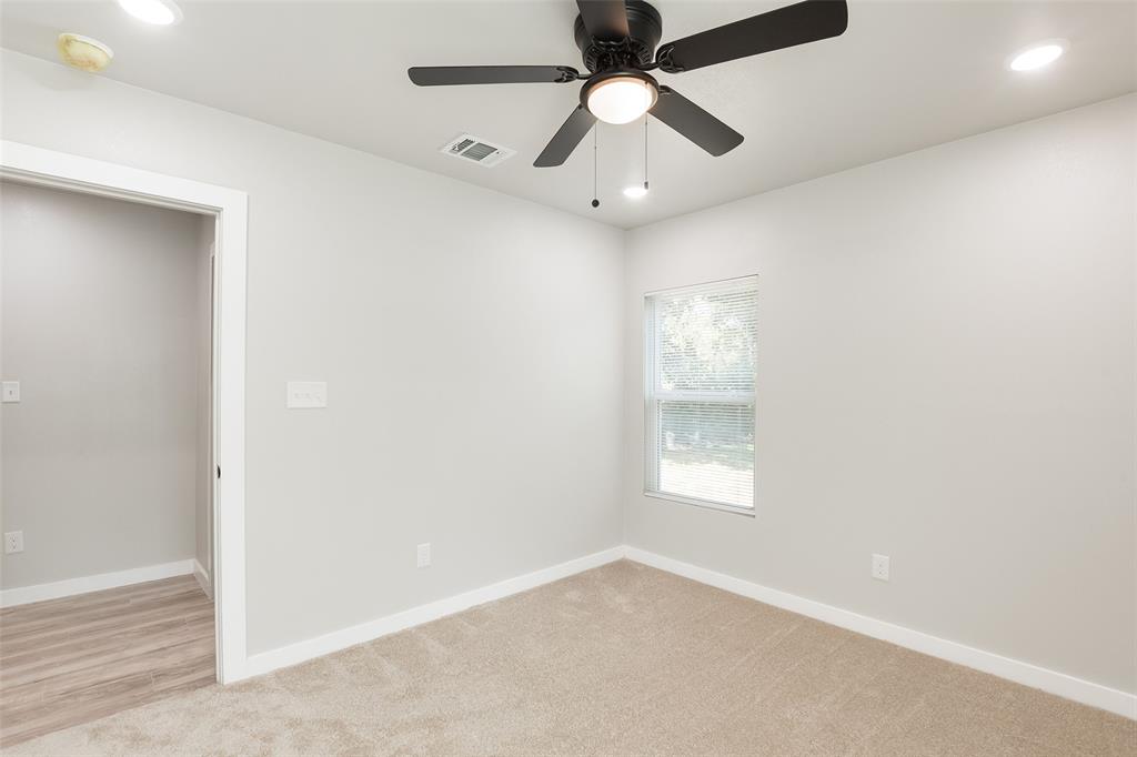 3110 Utah Avenue Dallas, TX 75216 - Photo 18 of 26 an empty room with a window and a fan