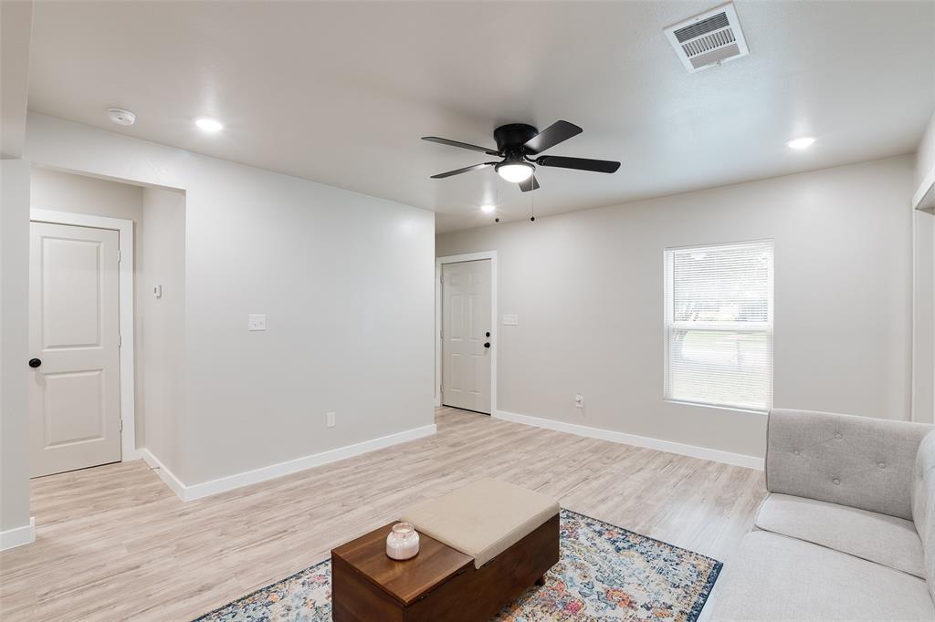 3110 Utah Avenue Dallas, TX 75216 - Photo 3 of 26 a living room with furniture and a window
