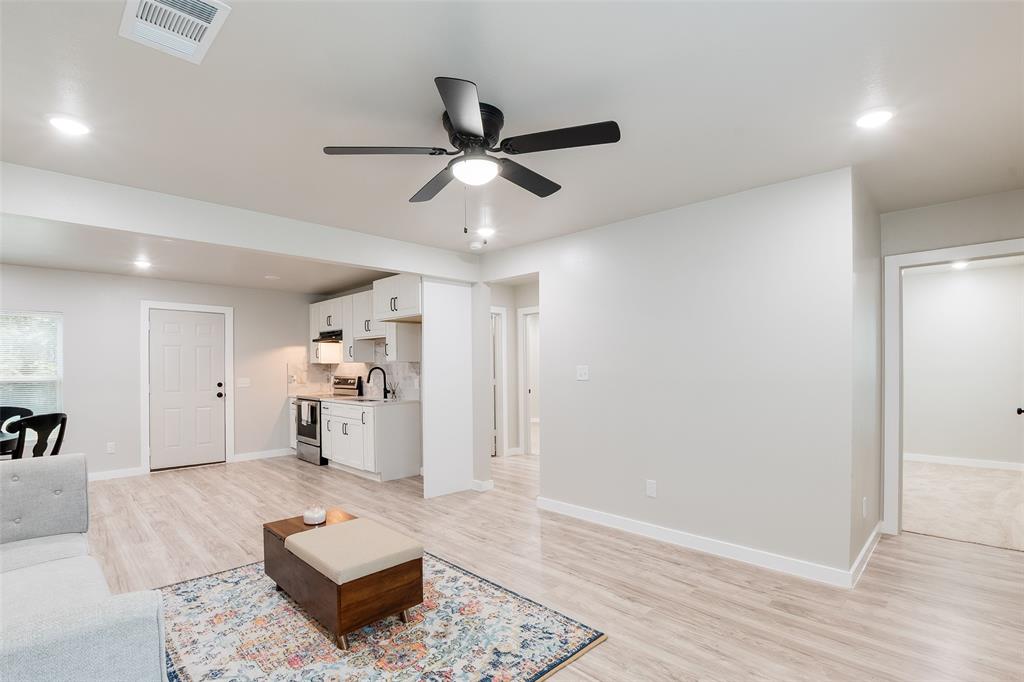 3110 Utah Avenue Dallas, TX 75216 - Photo 8 of 26 a living room with furniture and a wooden floor