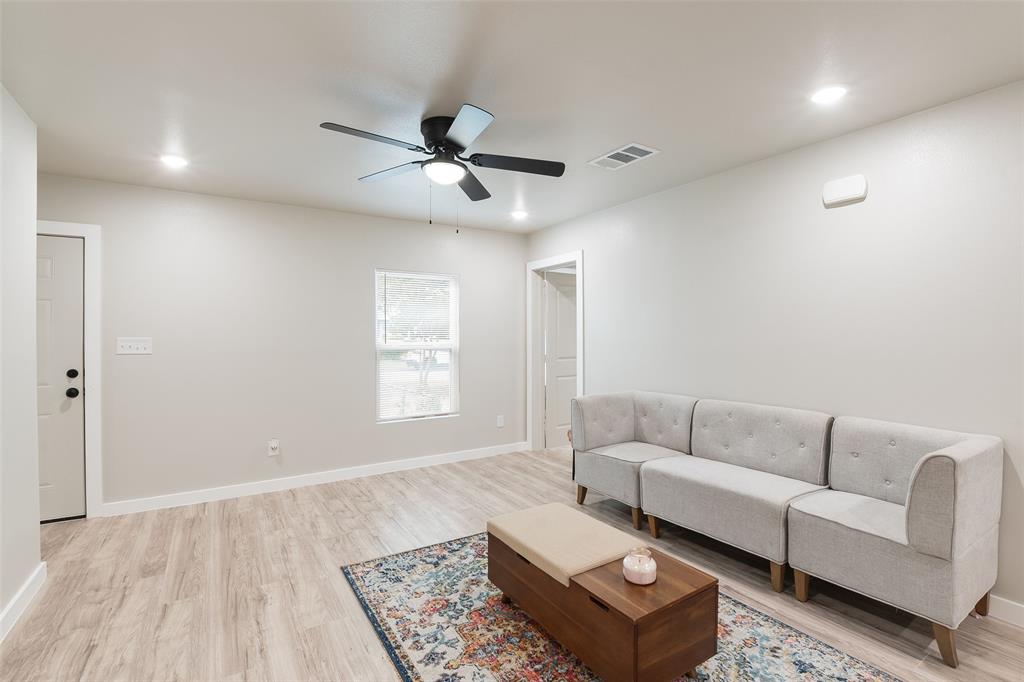 3110 Utah Avenue Dallas, TX 75216 - Photo 9 of 26 a living room with furniture and a rug