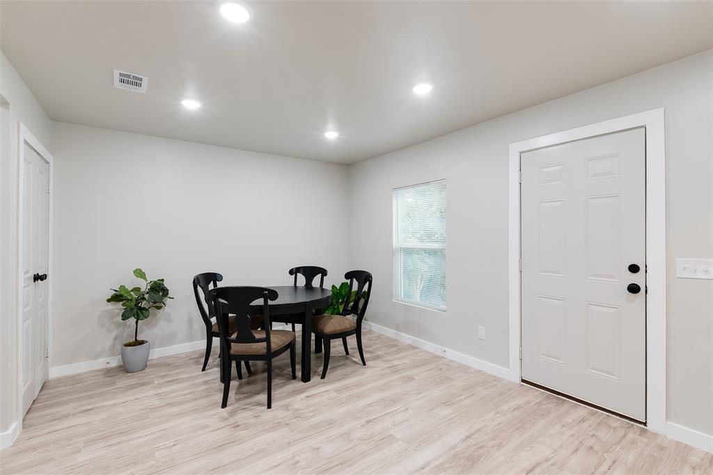 3110 Utah Avenue Dallas, TX 75216 - Photo 10 of 26 a view of a dining room with furniture and wooden floor
