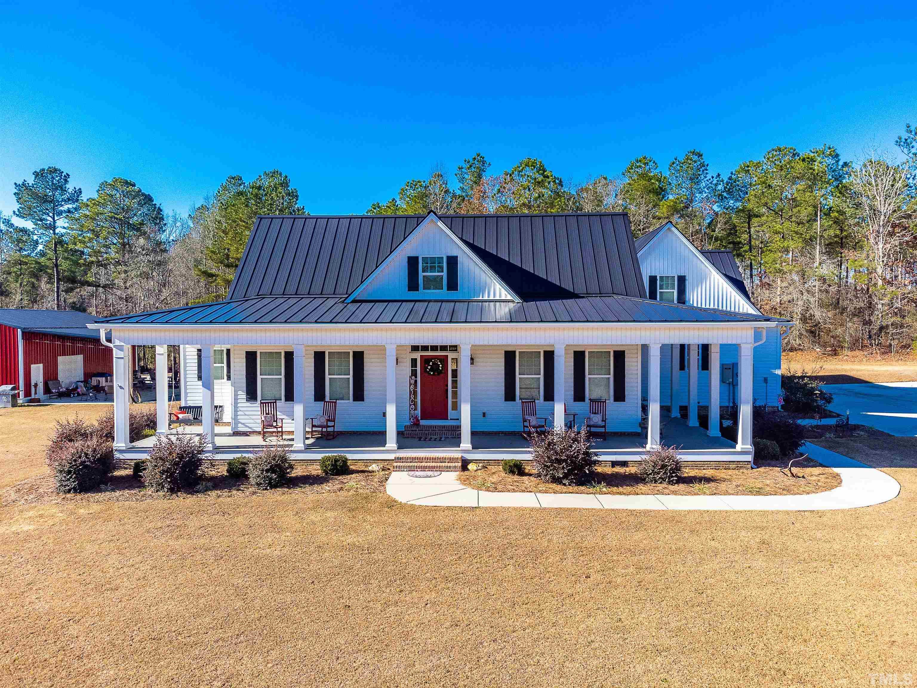 4300 Debnam Road Zebulon, NC 27597 - Photo 1 of 54 a view of a house with swimming pool and sitting area