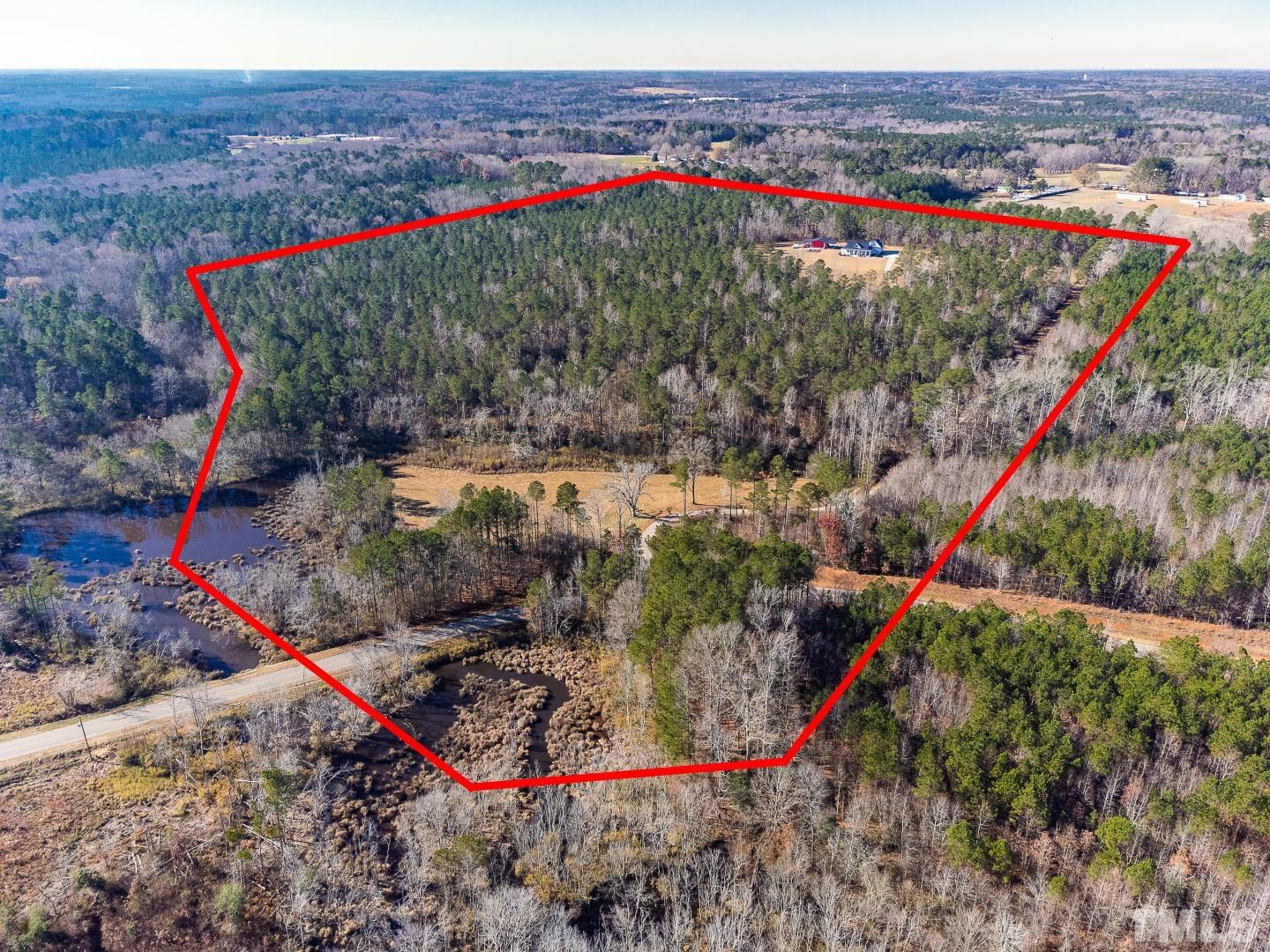 4300 Debnam Road Zebulon, NC 27597 - Photo 2 of 54 a view of a park with a large tree
